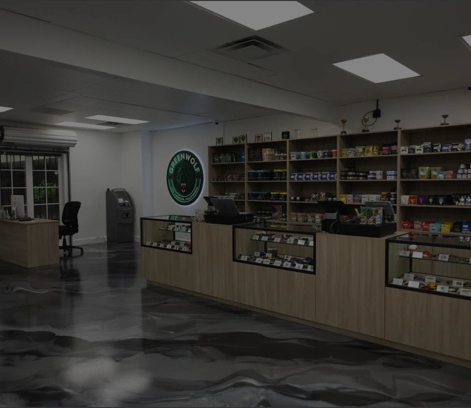 Inside Greenwolf dispensary showcasing organized shelves with various cannabis products.